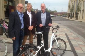 Electric bike and Peter Dawe Sean Moroney and Chris Massey